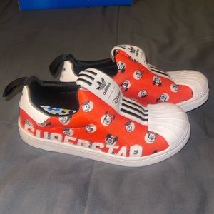 Gentle worn Mickey and Friends slip on adidas